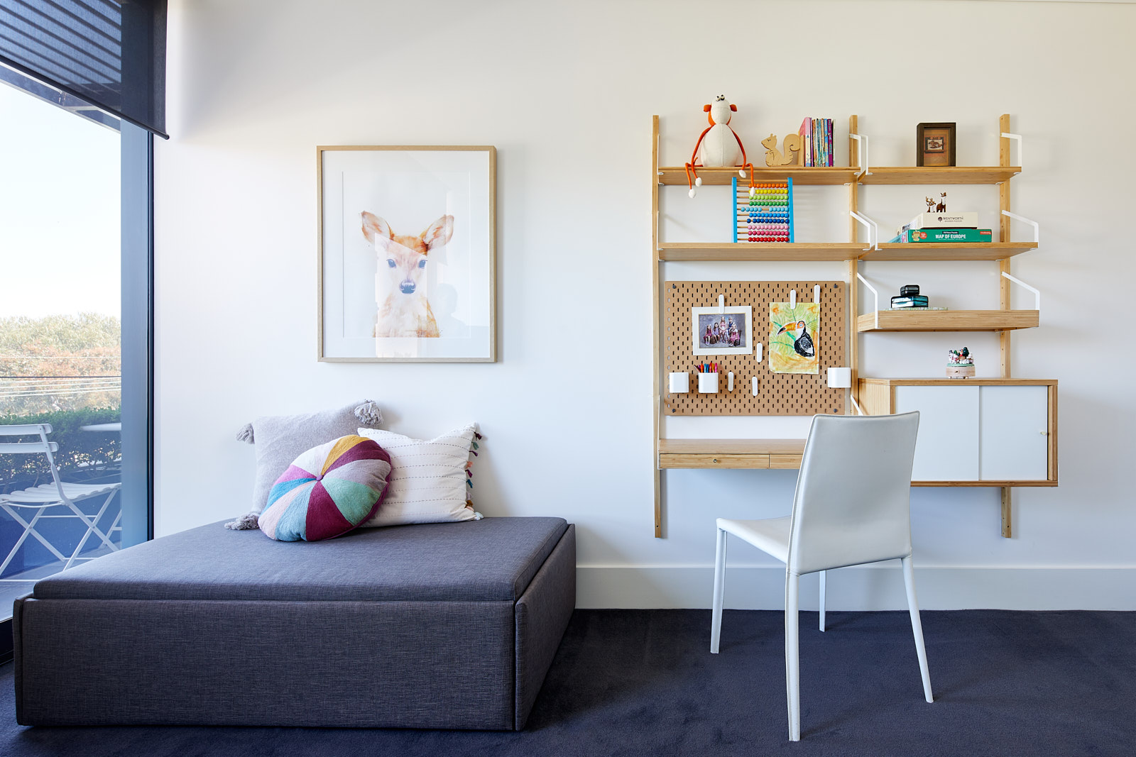 Playroom bookcase -This playroom functions as a spare time guest room and has heaps of room for storage