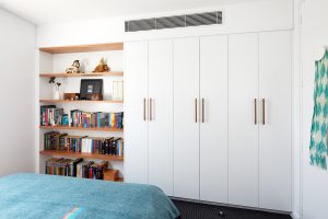 Girl's bedroom with custom joinery bookcase and wardrobe